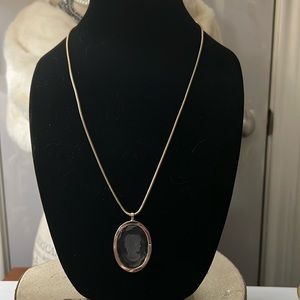 Clear cameo on a gold chain